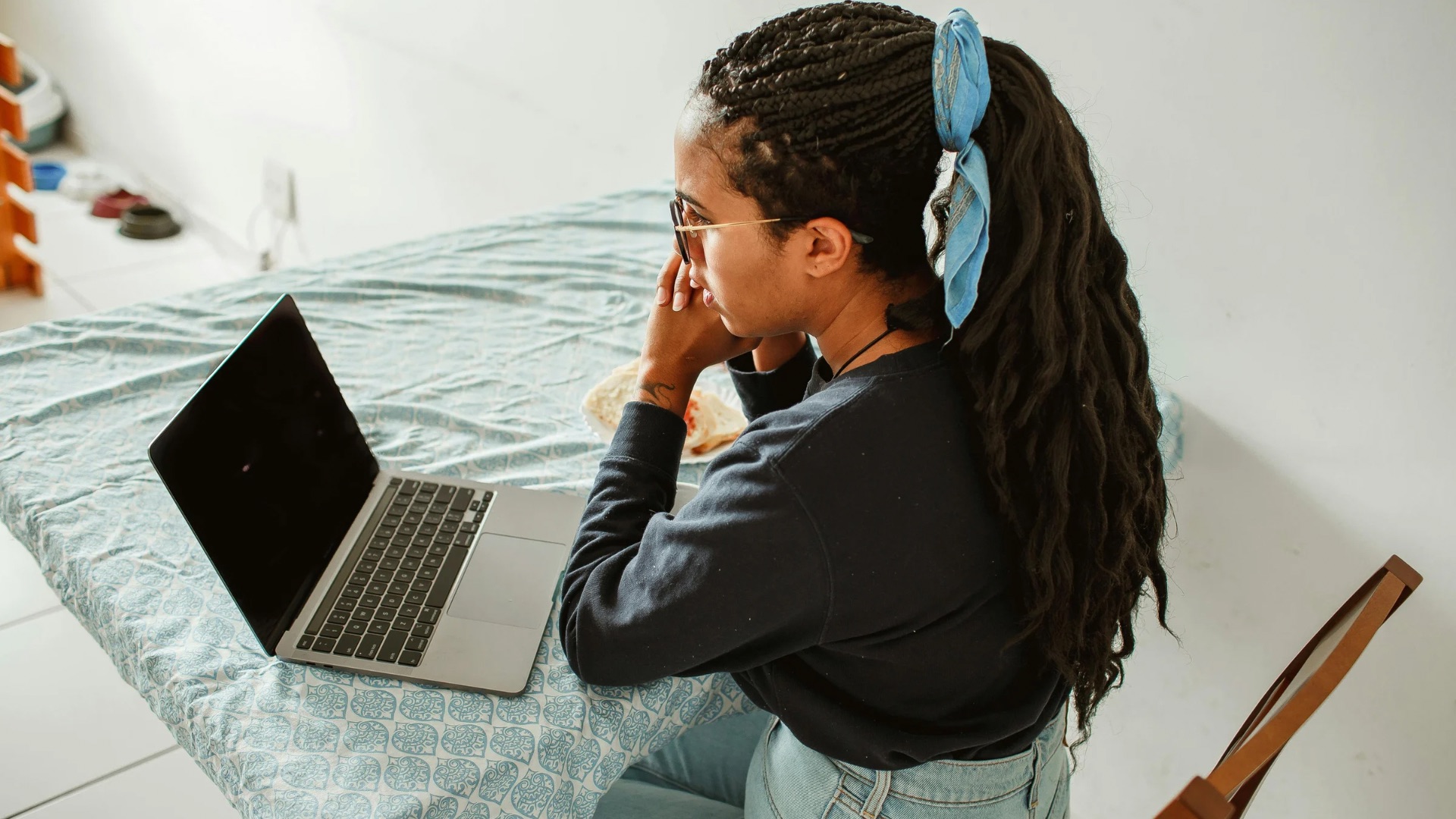 Image of a marketing professional checking her CV on Laptop